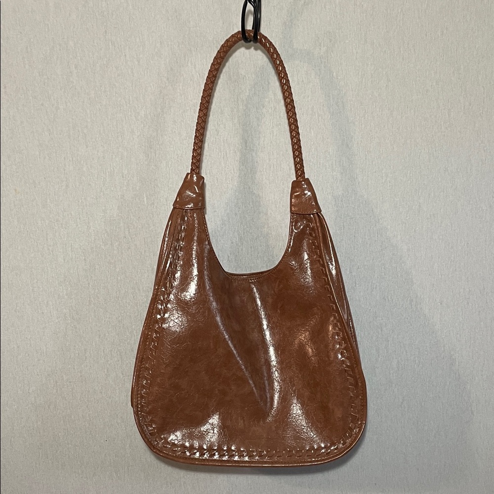 Elegant Brown Leather Shoulder Bag. Has no brand